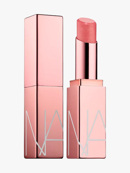 Nars Afterglow Tinted Lip Balm in branded component on a light gray background